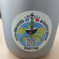 Ein Sticker auf dem ein QR-Code ist mit Earthy, dem Maskottchen und dem Schriftzug "Make the earth a  better place".